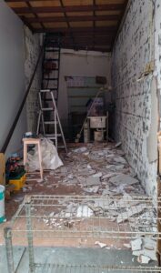 A_shop_under_renovation,_with_debris_of_construction_materials_all_around,_Tai_Po,_Hong_Kong